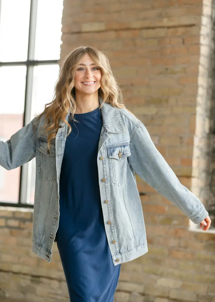 Brinx light wash oversized denim trucker jacket featuring classic button closure and front pockets in light-wash denim