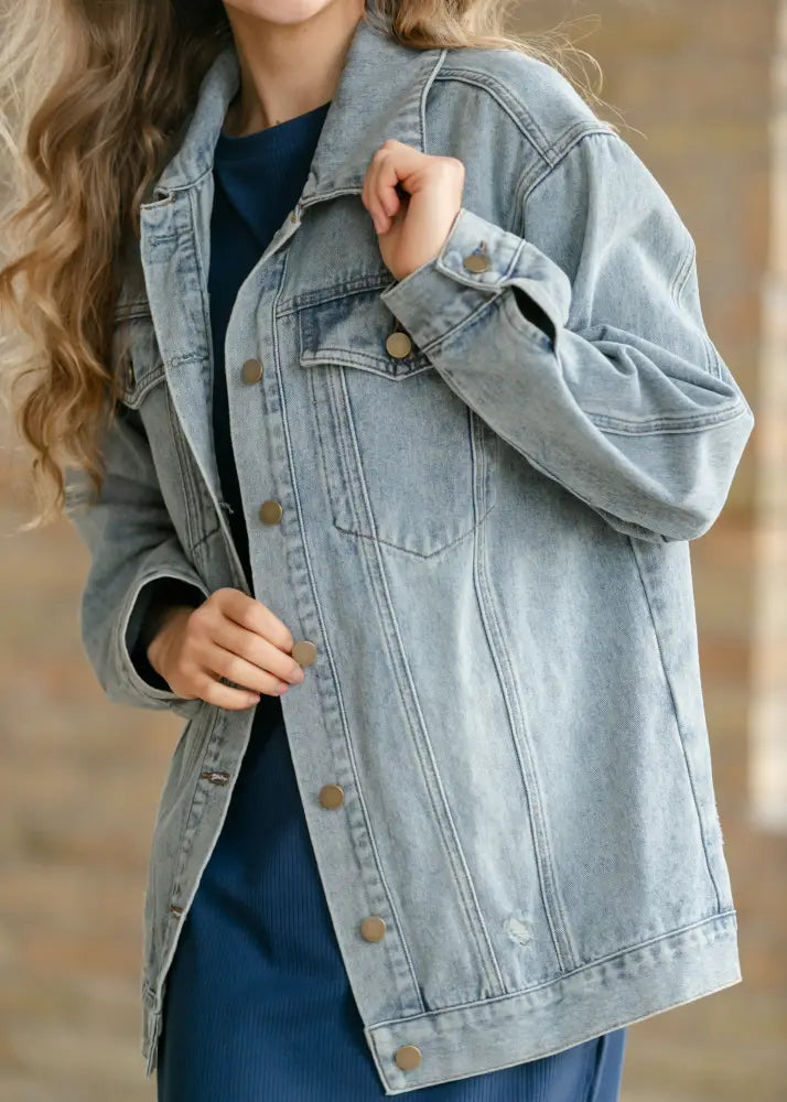 Brinx light wash oversized denim trucker jacket with classic button closures and subtle distressing in light-wash denim