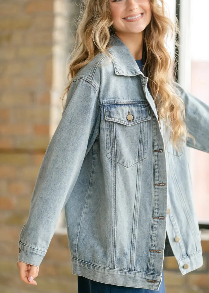 Brinx light wash oversized denim trucker jacket with classic button closures and a faded distressed look
