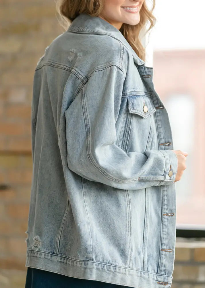 Brinx light wash oversized denim trucker jacket with classic button-front design and subtle distressing details