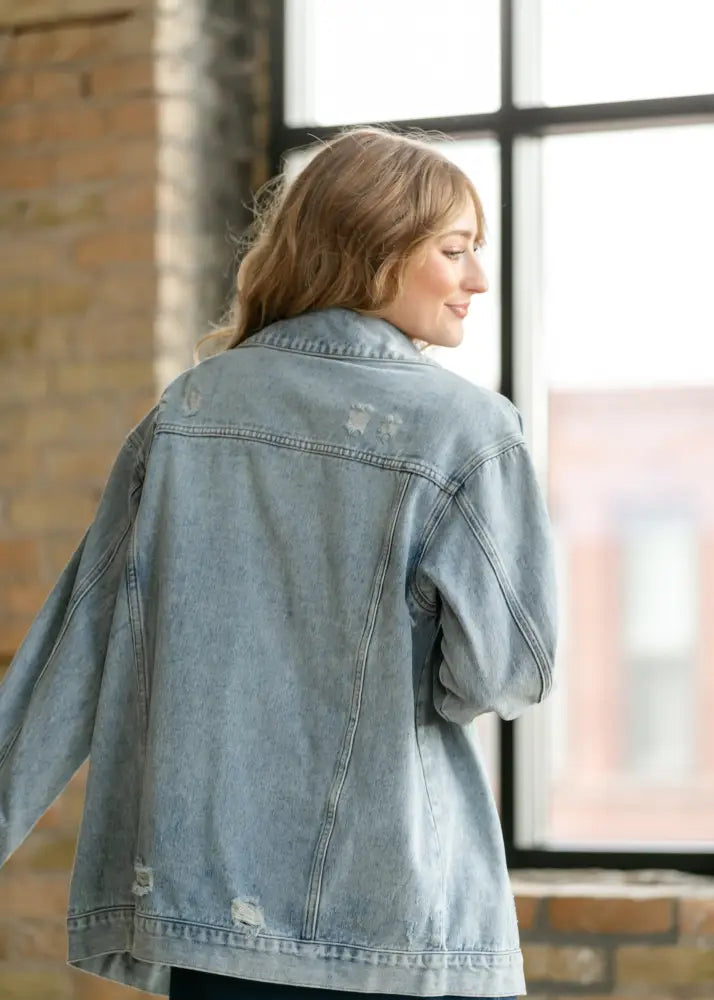 Brinx light wash oversized denim trucker jacket featuring subtle distressing and a relaxed fit