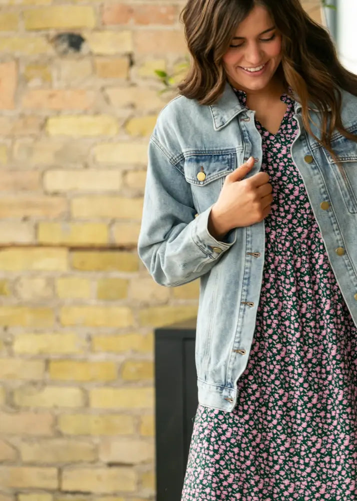 Brinx light wash oversized denim trucker jacket with gold tone buttons and classic flap pockets in light wash denim