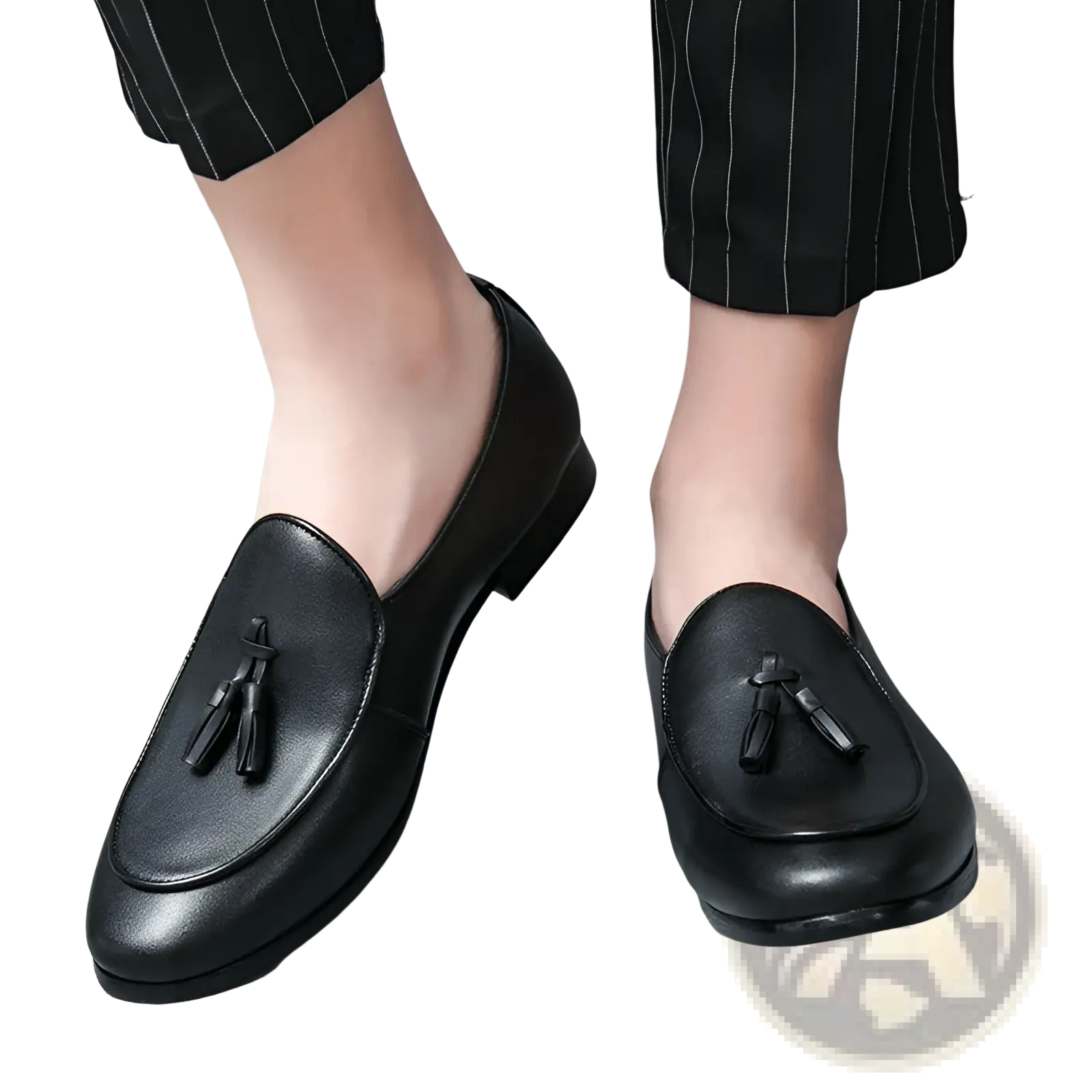 Black leather tassel loafers for young men with a polished finish and classic slip-on design