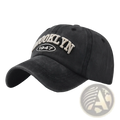 Black distressed cotton baseball hat with brooklyn 1947 embroidered in off white thread on the front