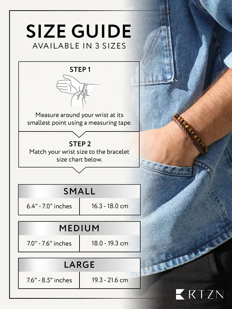 Brown wooden bead tiger eye and braided leather bracelet with steel clasp worn on a man’s wrist