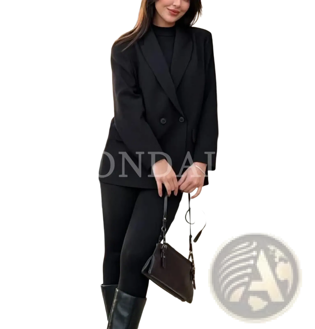 Black leather crossbody bag with minimalist design and structured rectangular shape paired with brown double breasted office blazer for women