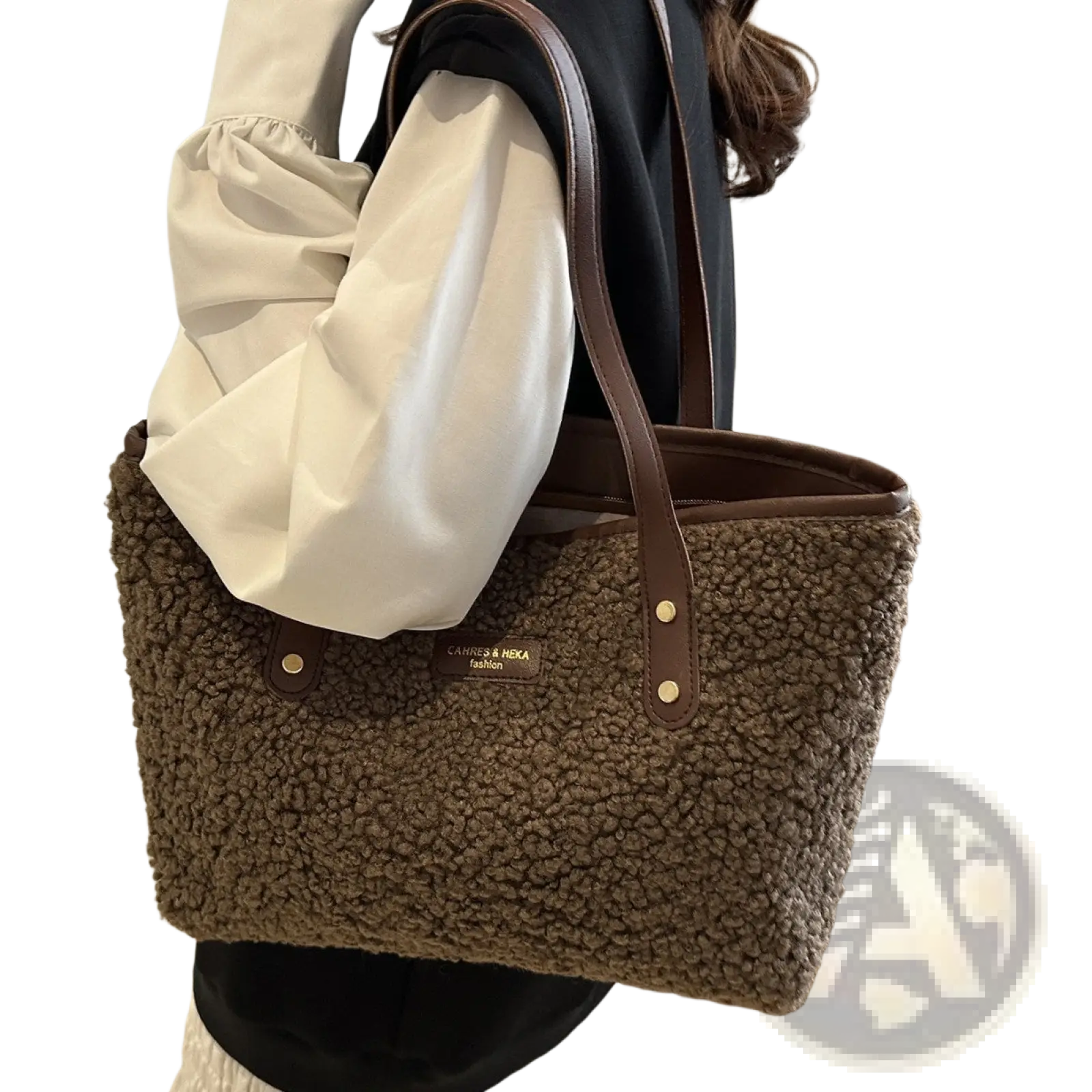 Brown faux fur tote bag with leather straps and gold tone hardware for stylish everyday use
