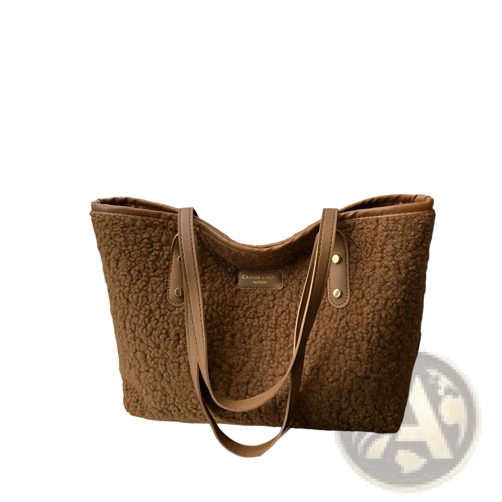 A cozy brown faux fur tote bag with matching leather straps and a small brand plaque on the front