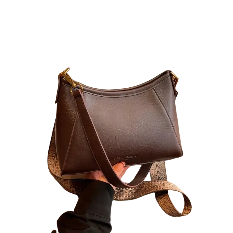 Brown leather crossbody shoulder bag for women with textured surface gold-tone hardware and adjustable woven strap