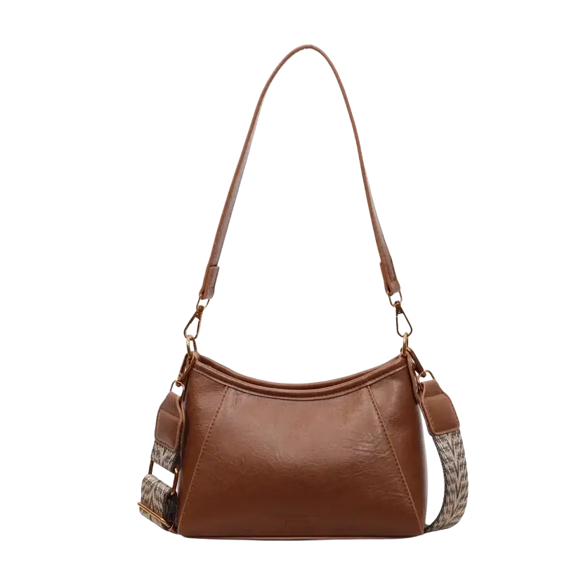 Brown leather crossbody shoulder bag for women with patterned fabric strap and gold tone hardware