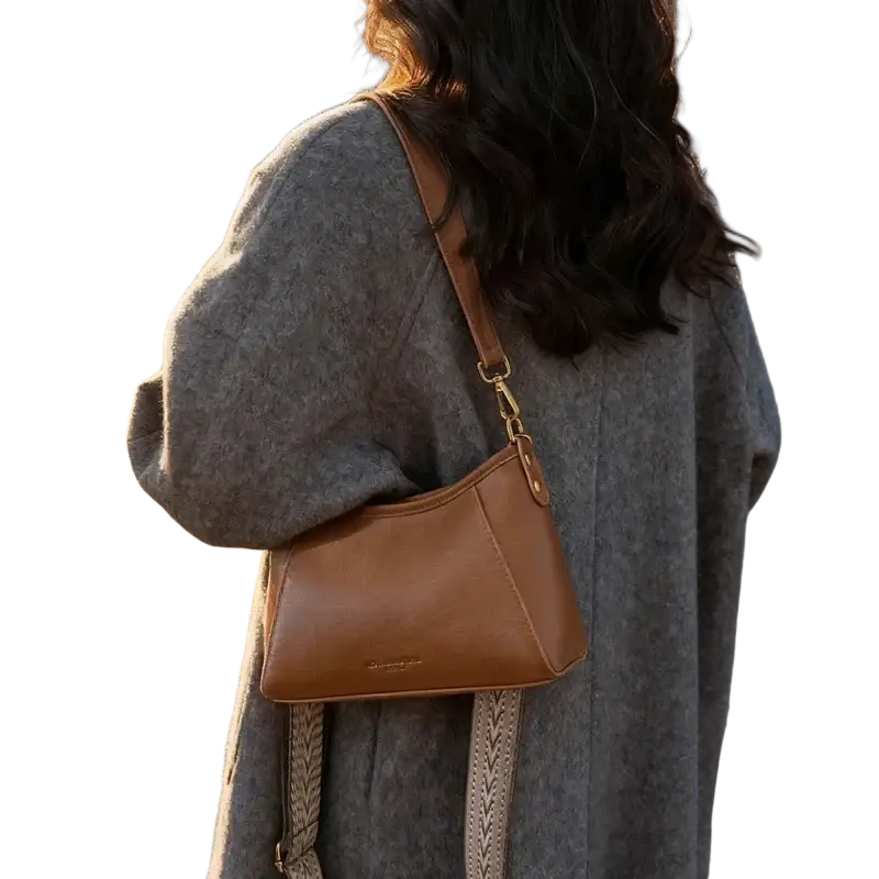 Brown leather crossbody shoulder bag for women with tan braided strap and gold tone hardware
