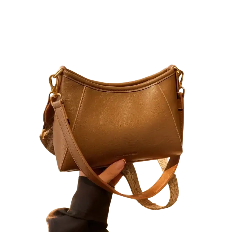 Brown leather crossbody shoulder bag for women with tan faux leather body, woven strap, and gold-tone hardware