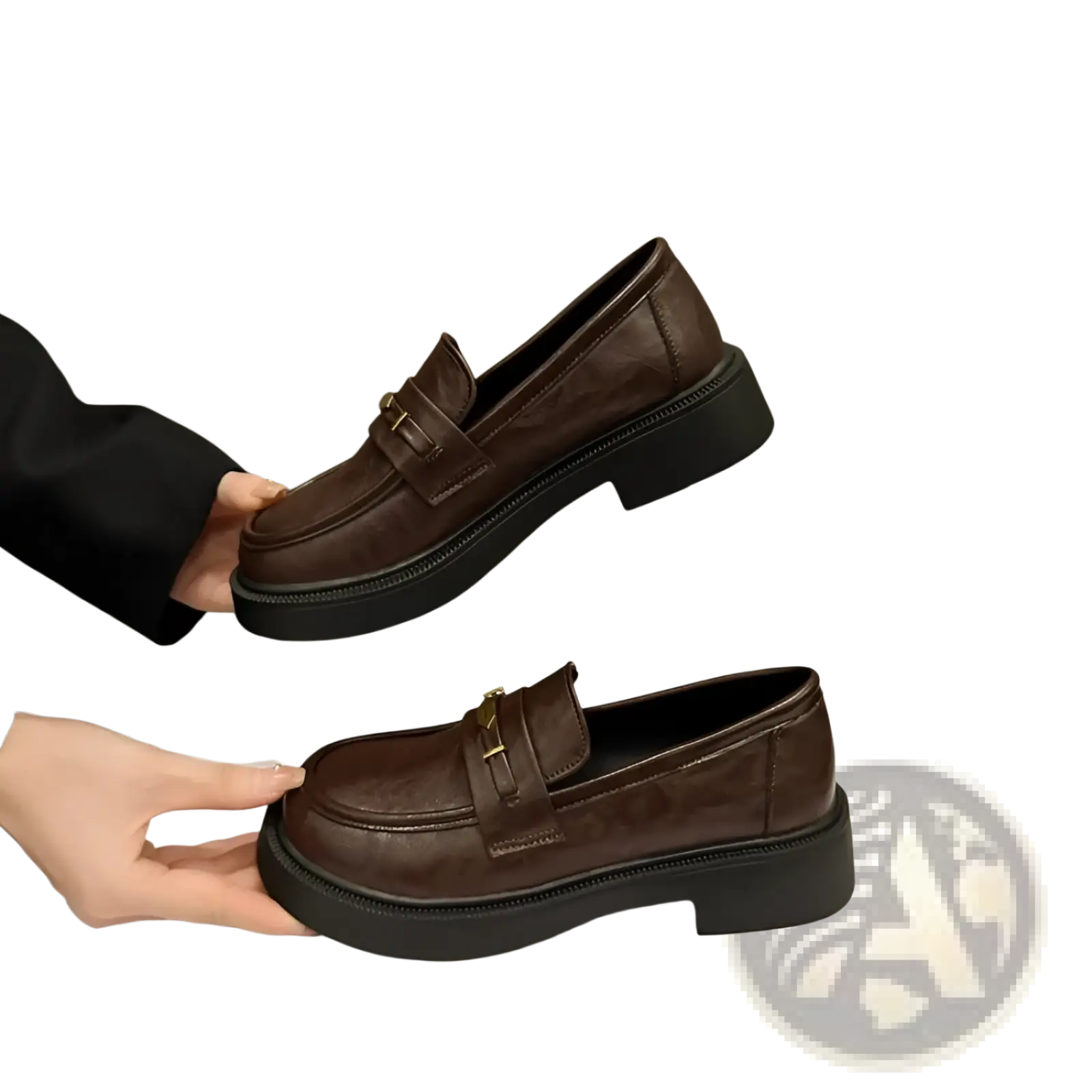 Brown leather loafers with a thick black sole and gold-tone buckle detail for stylish formal wear