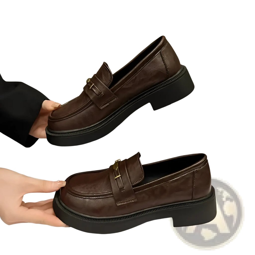 Brown leather loafers with thick black rubber sole and gold-tone buckle detail for stylish formal wear