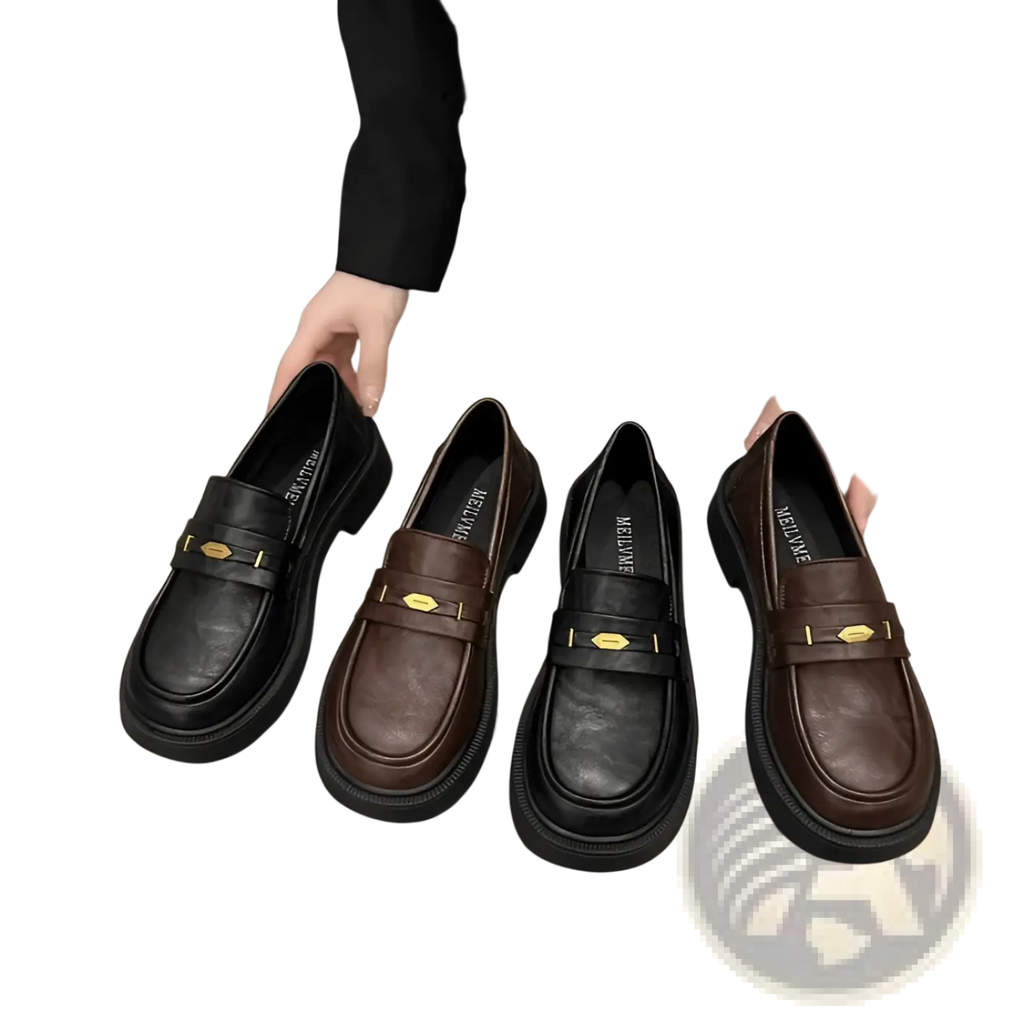 Brown and black leather loafers with gold-tone metal buckle detail showcasing elegant formal footwear