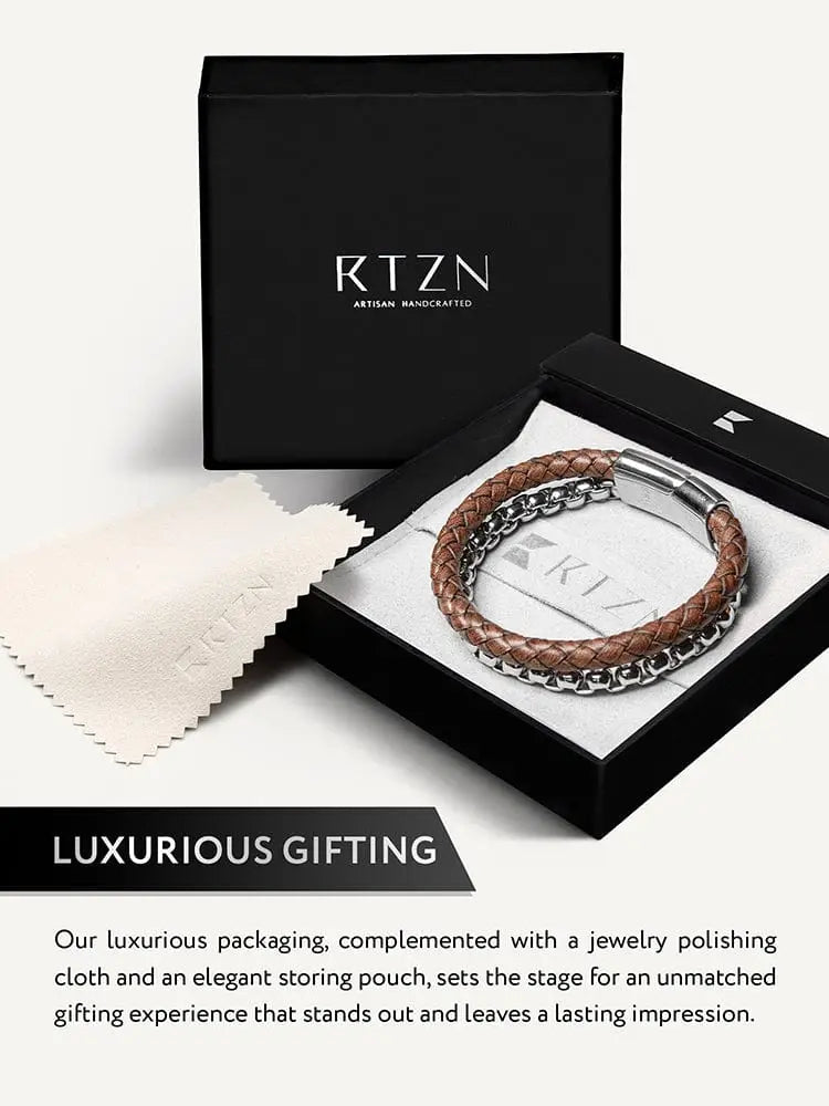 Brown braided leather and silver box chain bracelet displayed in a black rtzn artisan handcrafted gift box