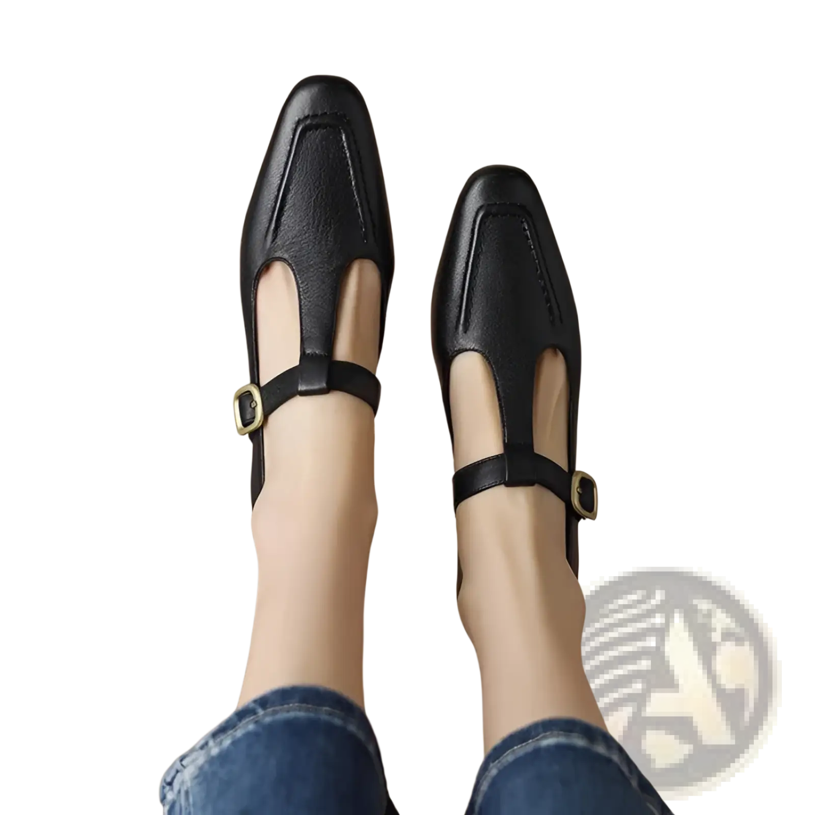Black leather t-strap flats with gold-tone buckle accents featuring a square toe and mary jane style