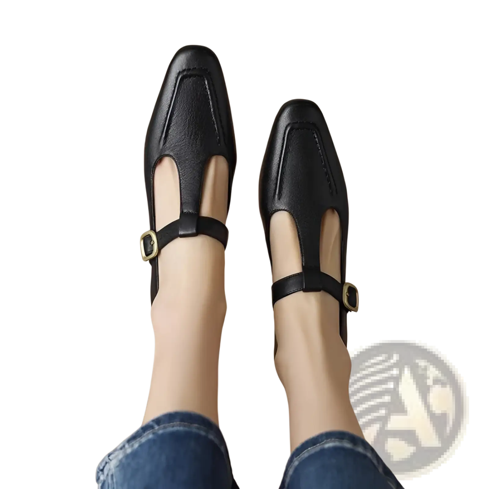 Black leather t-strap flats with gold-tone buckle accents featuring a square toe design for elegant wear
