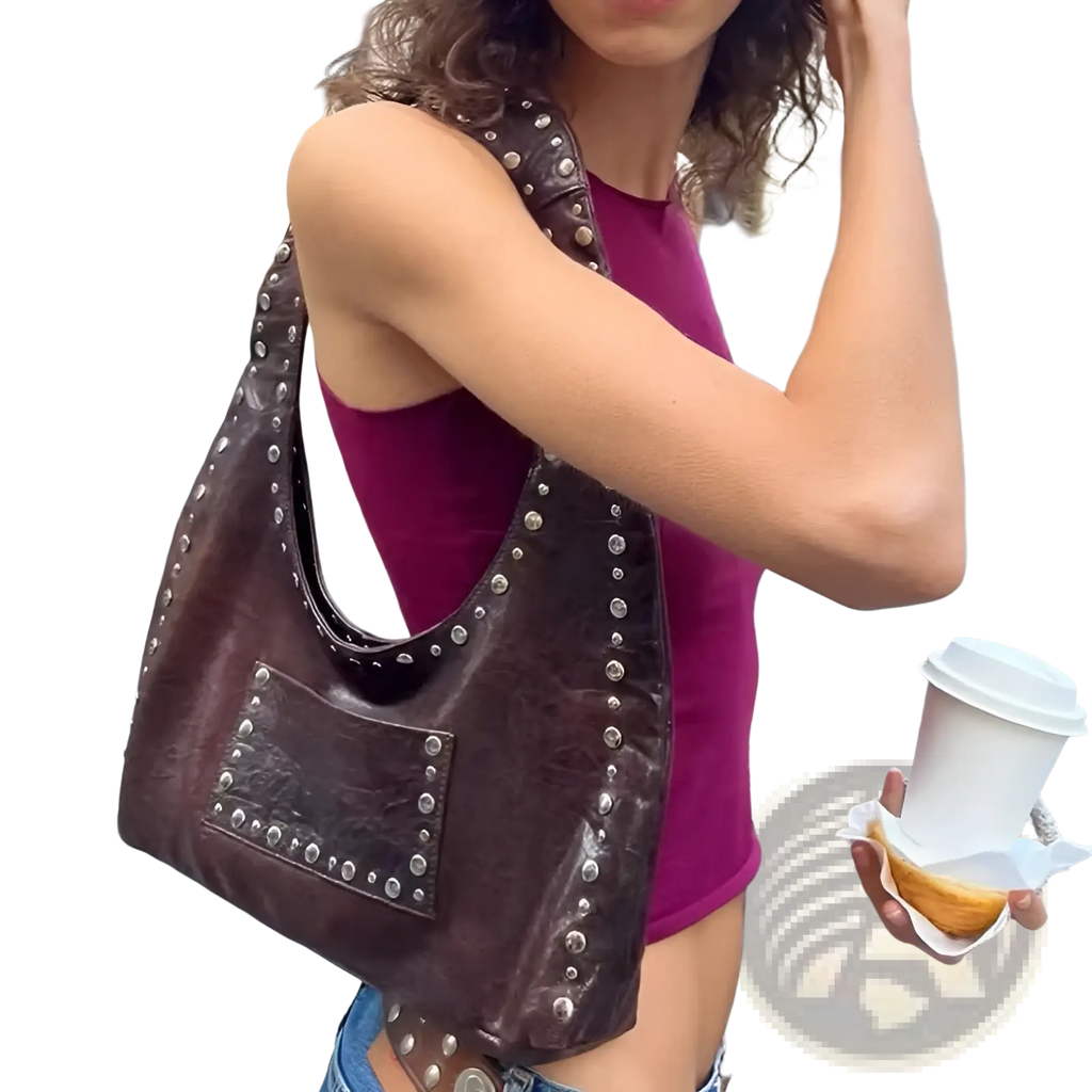 Brown studded leather shoulder bag with silver-toned studs and front pocket in a retro hobo purse design
