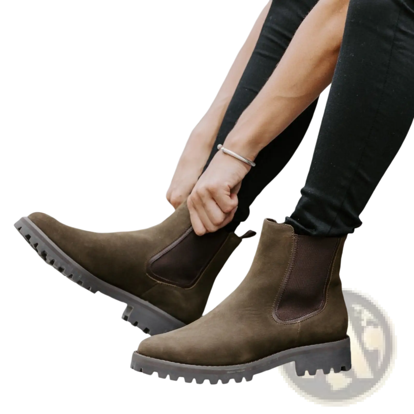 Brown suede chelsea boots with chunky platform rubber sole displaying stylish and durable footwear design