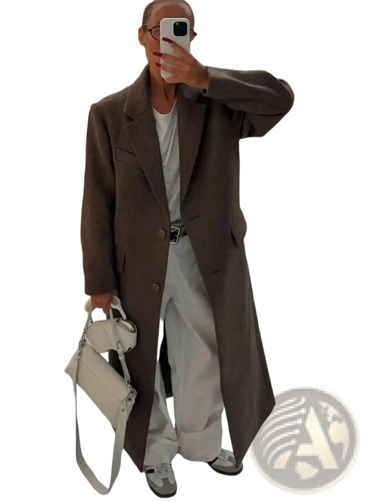 A sleek off-white leather handbag with structured design and silver hardware paired with brown wool blend overcoat for women