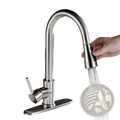 Brushed copper pull out kitchen faucet with modern stainless steel finish and sleek curved spout with pull-down spray head