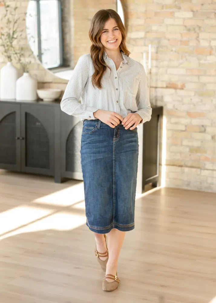Bryn dark wash straight denim midi skirt with a mid-thigh length and subtle fading in classic straight cut