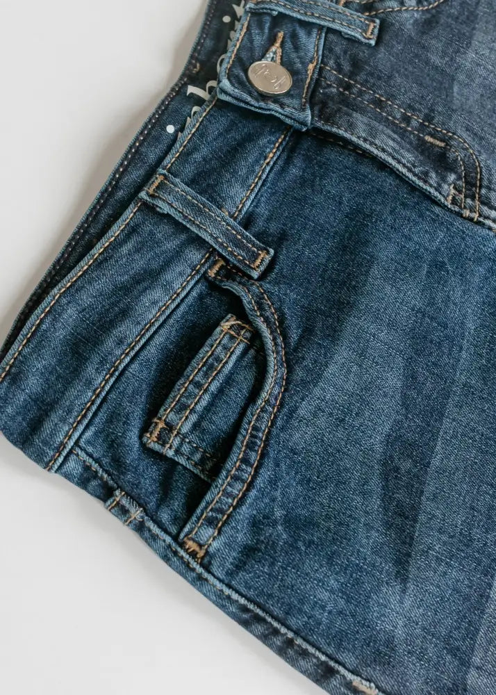 Bryn dark wash straight denim midi skirt with classic five-pocket design and visible stitching in dark-wash denim