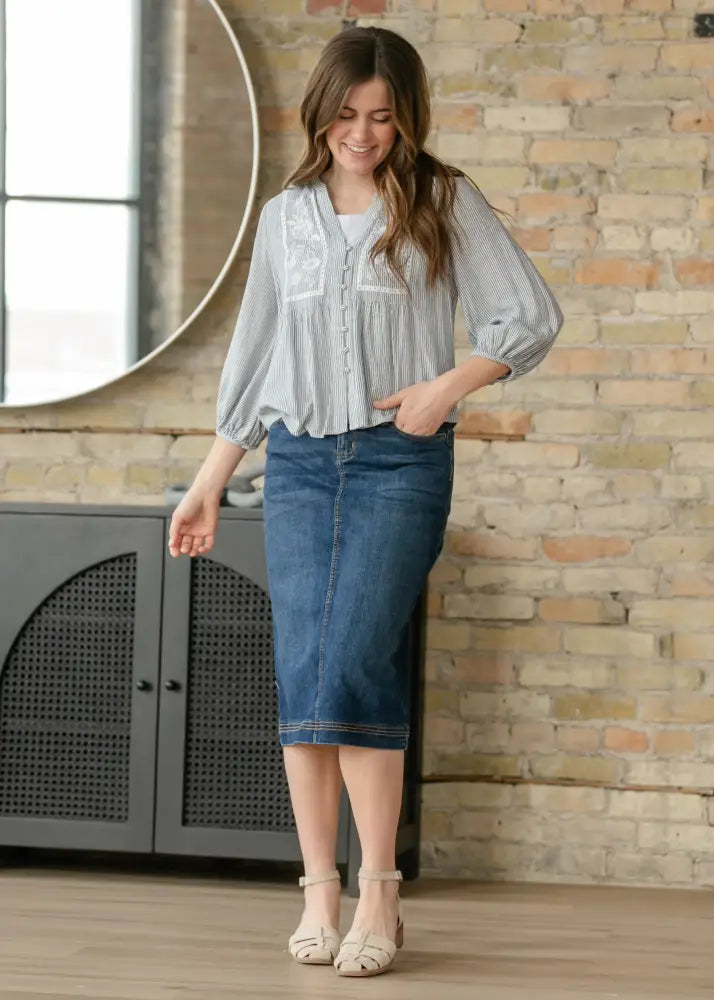 Blue denim midi skirt with a straight cut and rolled hem in dark wash Bryn denim fabric