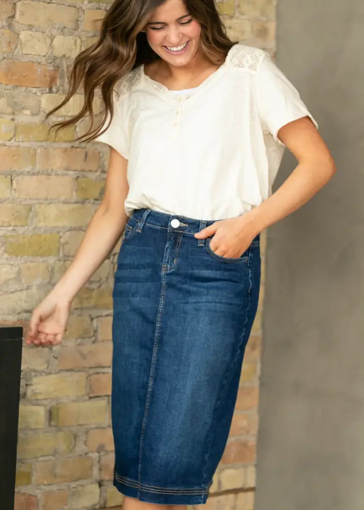 Bryn dark wash straight denim midi skirt in classic blue with subtle stitching and mid-thigh length design