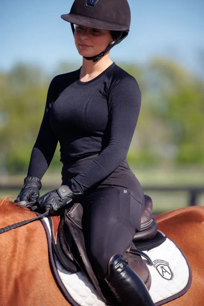 Black long-sleeved btr active women’s seamless upf 30 sun protection baselayer with snug fit and subtle seam detailing