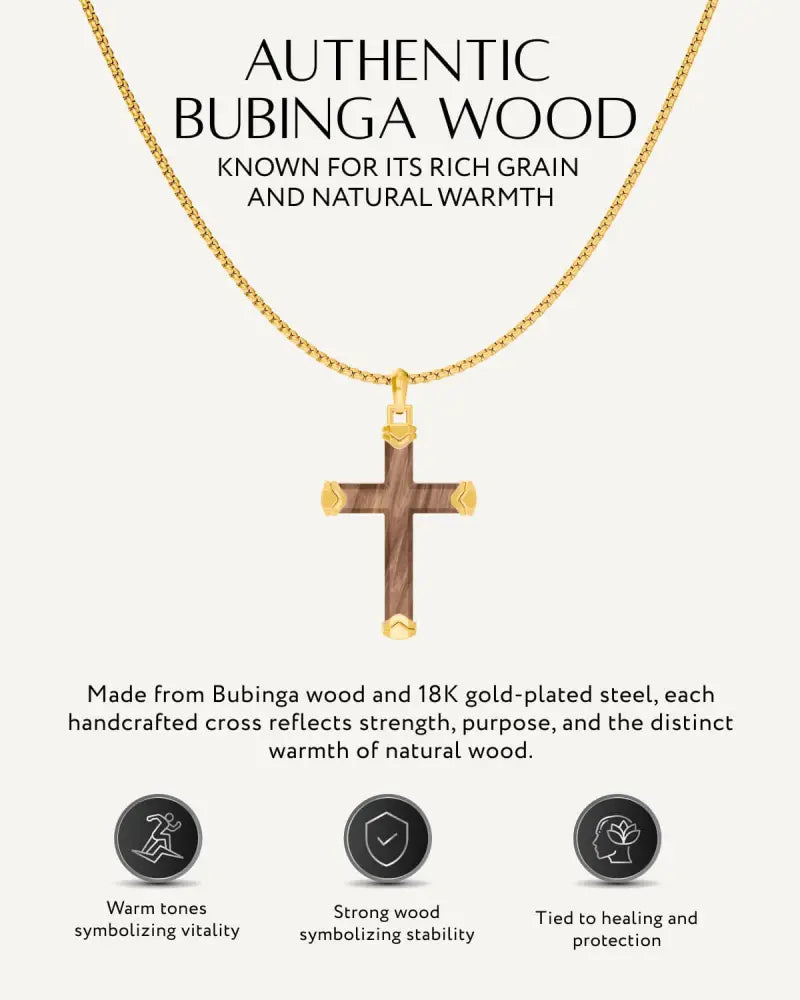 Bubinga wood cross pendant with gold plated steel accents on a delicate gold chain necklace