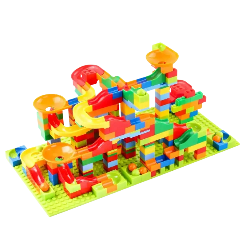 Building block marble run track set with vibrant multi-colored plastic blocks, green baseplate, and orange launchers