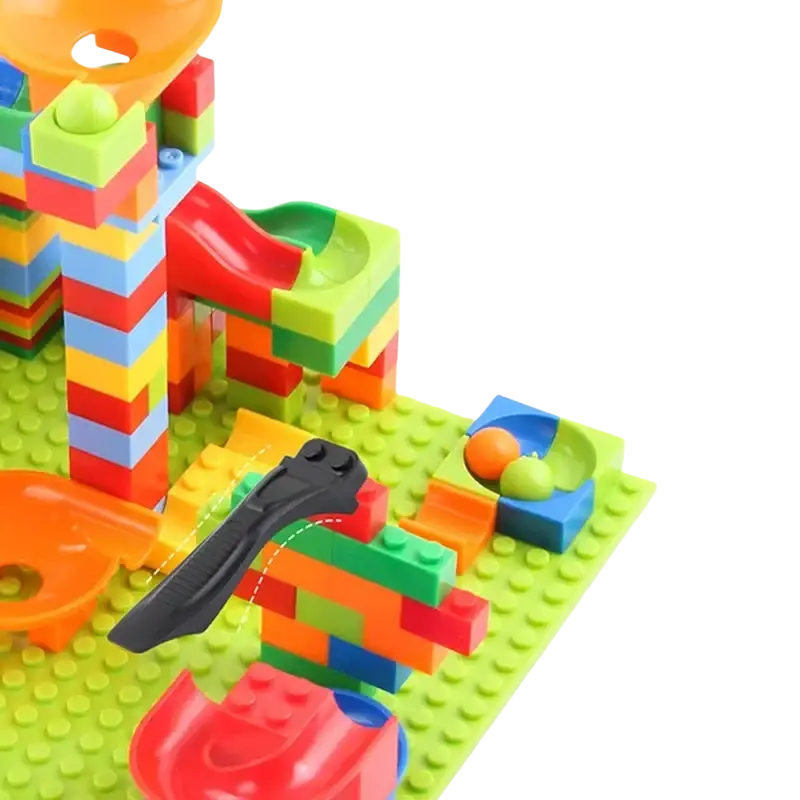 Vibrant building block marble run track set with interlocking rainbow blocks and transparent orange and green tracks