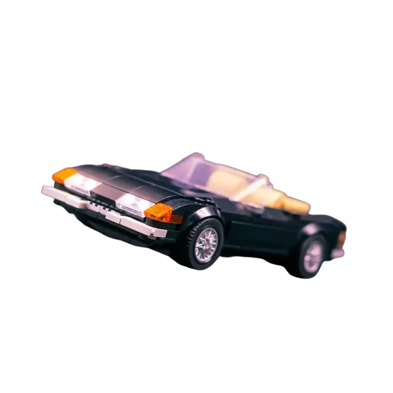 Black lego convertible sports car with orange headlights yellow interior and printed parts building block model 677