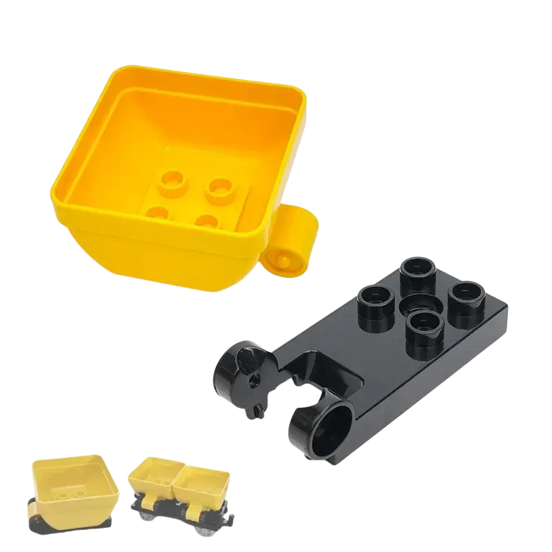 Yellow plastic dump truck bed with black chassis and wheels for building blocks duplo compatible train car toys back side view