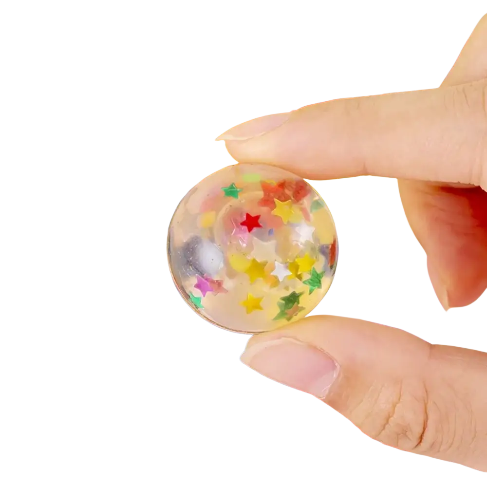 A clear round gel bulk bouncy ball filled with colorful star-shaped confetti for party favors assortment