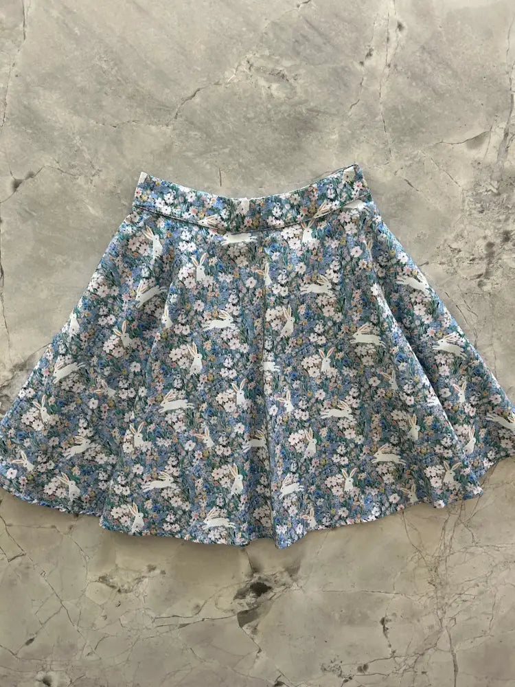 Vintage bunny floral cotton skater skirt with flared design in soft blues whites and pastel pinks featuring rabbit pattern
