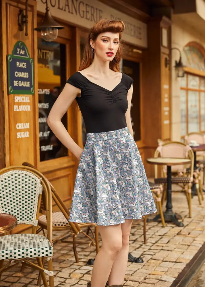 Vintage bunny floral cotton skater skirt featuring a flared mid-thigh length design in soft blue and white floral pattern