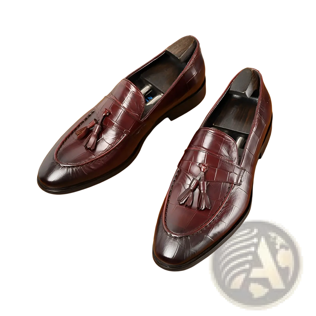 Burgundy crocodile embossed leather tassel loafers showcasing elegant texture and classic slip-on design