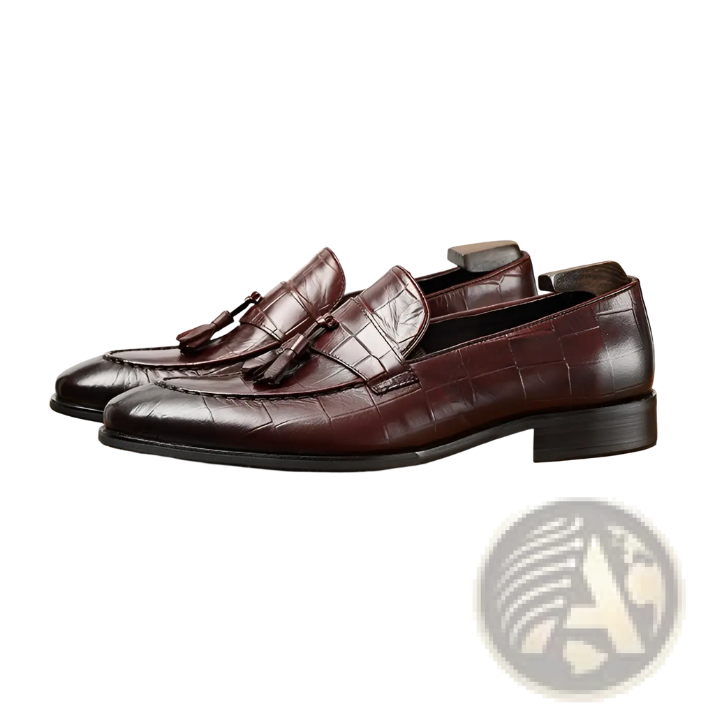 Burgundy crocodile embossed leather tassel loafers with a low block heel for stylish formal wear