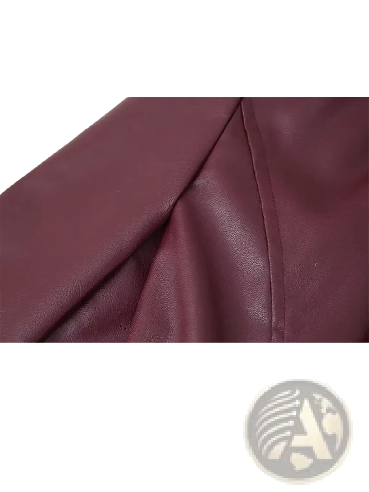 Burgundy faux leather belted jacket sleeve with smooth textured surface and precise stitching along the seam