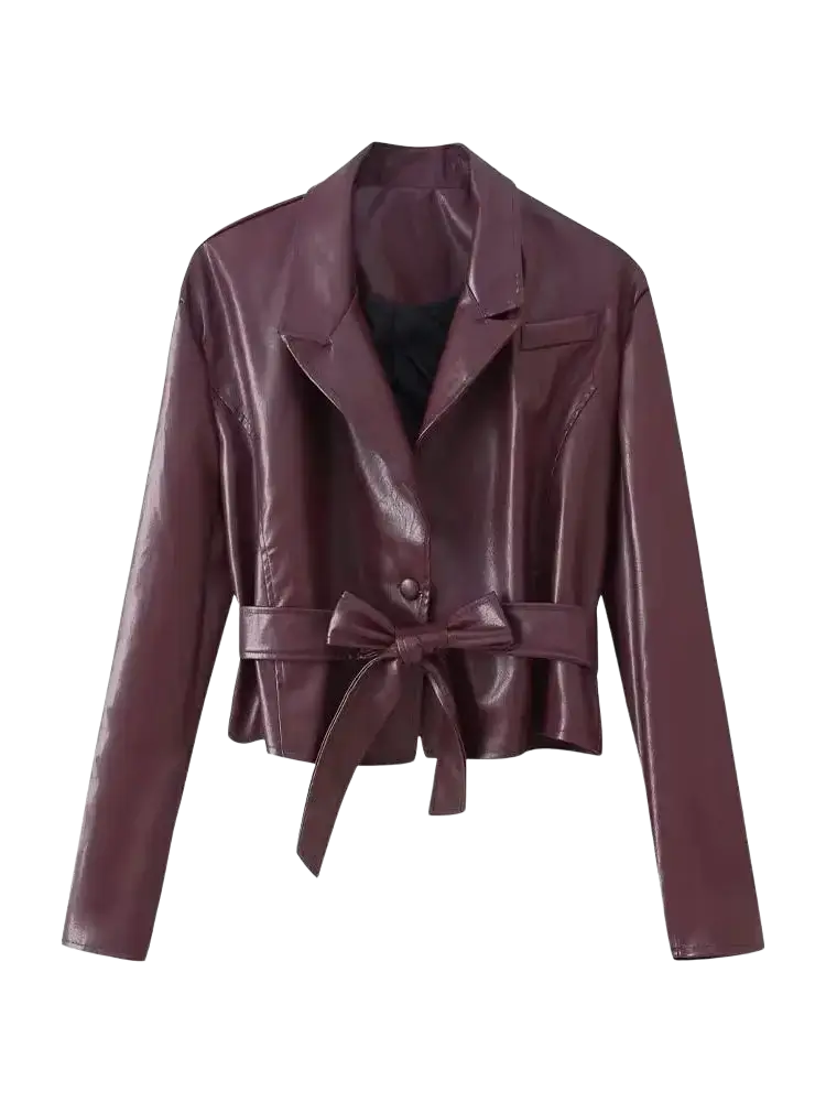 A sleek burgundy faux leather belted jacket with tailored collar and bow tie waist detail