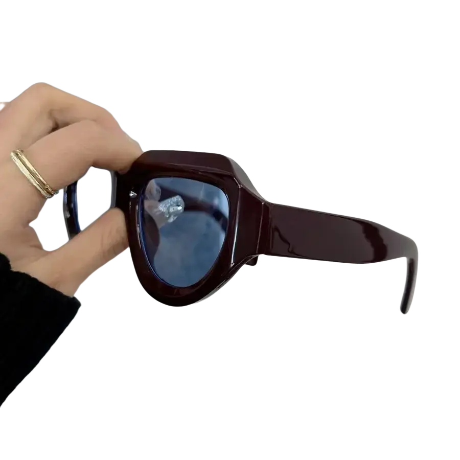 Burgundy geometric sunglasses for women and men with dark brown glossy acetate angular frames and blue-tinted lenses