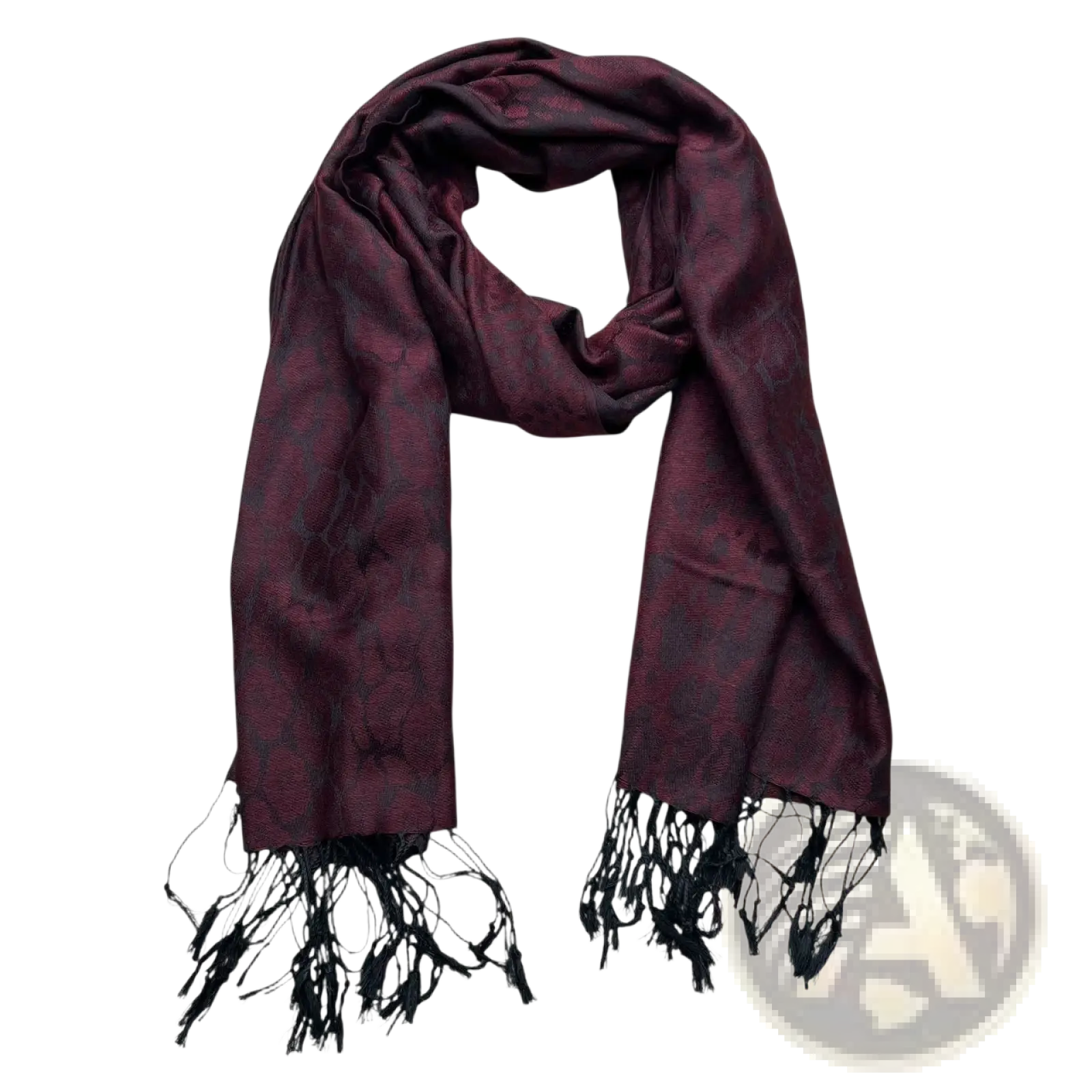 A luxurious burgundy jacquard long winter scarf with a subtle intricate pattern and black fringe detailing