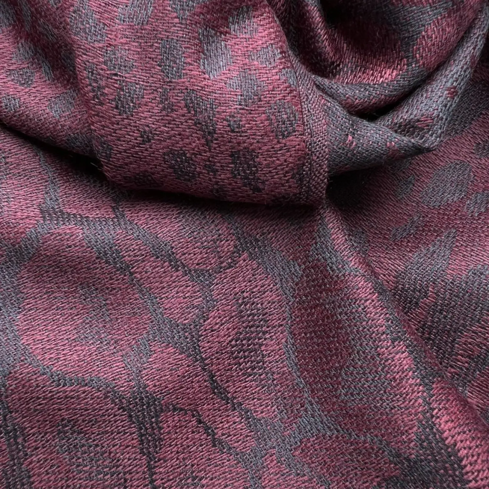 Burgundy jacquard long winter scarf with rich burgundy and dark gray woven fabric featuring an intricate geometric design