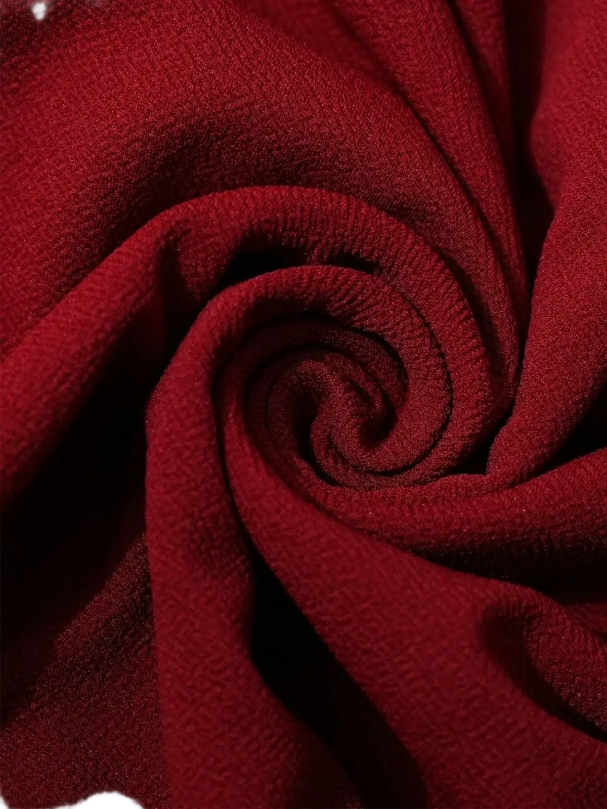 Burgundy lace formal dress featuring deep red soft textured fabric with a subtle ribbed weave detail