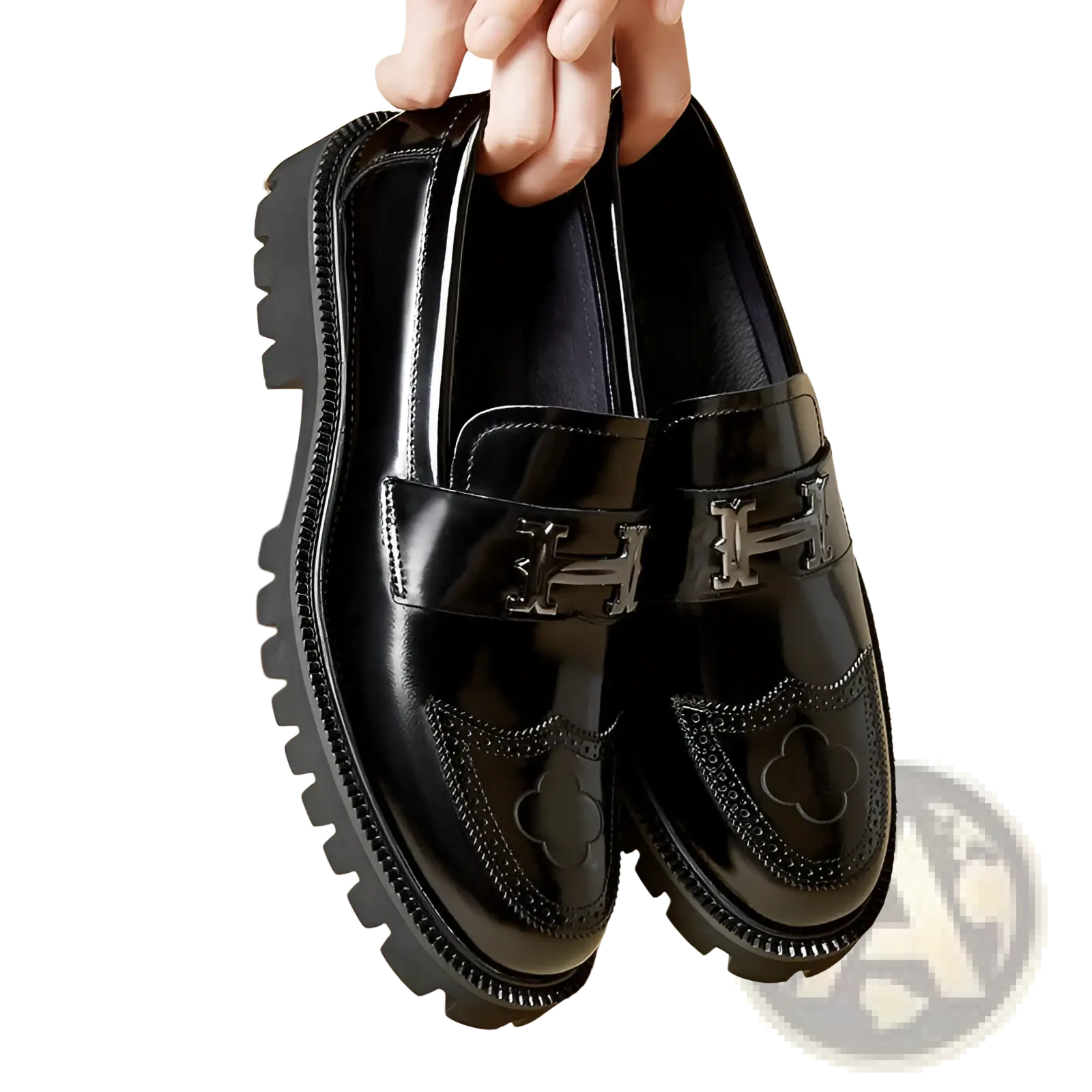 Black patent leather loafers with silver-tone h-shaped buckles and clover embroidery on the toe with rubber sole