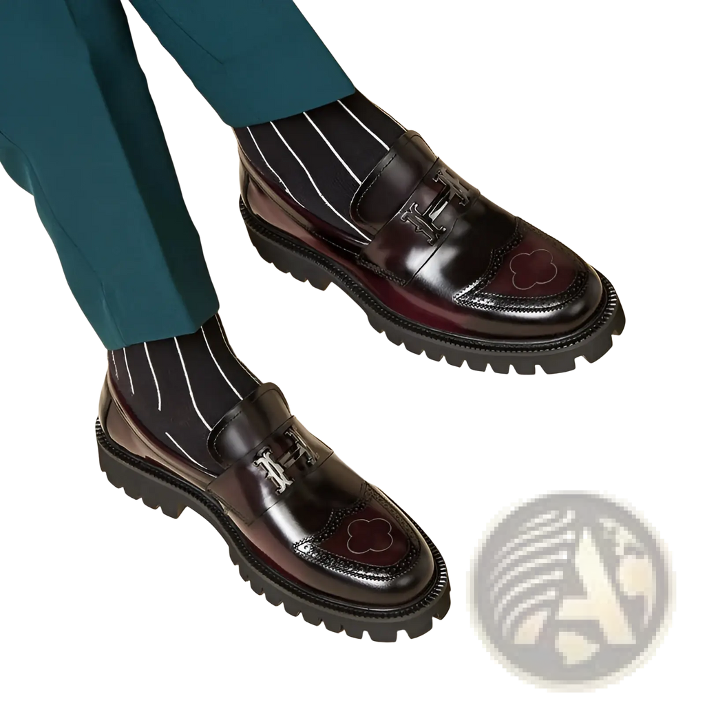 Burgundy leather loafers with black patent buckle, silver h logo, cloud brogue toe, and chunky rubber sole