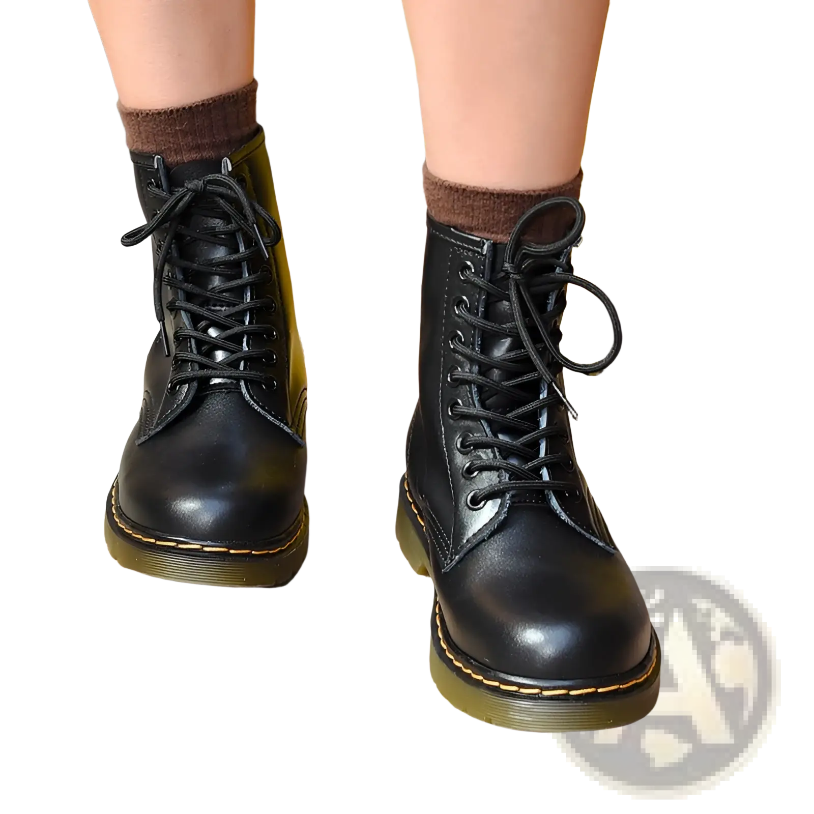 Black leather martin boots with yellow stitching featuring a lace-up design and classic dr style